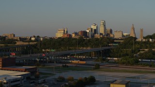 DX0001_001168 - 5.7K aerial stock footage of the skyline at sunset while descending in Downtown Kansas City, Missouri