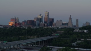 DX0001_001188 - 5.7K aerial stock footage flyby city skyline at twilight, seen from I-670, Downtown Kansas City, Missouri