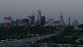 DX0001_001189 - 5.7K aerial stock footage static view and flyby of city skyline at twilight, seen from I-670, Downtown Kansas City, Missouri
