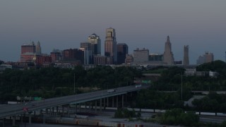 DX0001_001192 - 5.7K aerial stock footage of the I-670 freeway and city skyline at twilight in Downtown Kansas City, Missouri