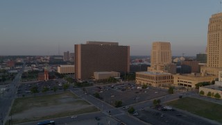 DX0001_001207 - 5.7K aerial stock footage fly away from a government building at sunrise, Downtown Kansas City, Missouri