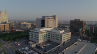 DX0001_001218 - 5.7K aerial stock footage approach government offices and federal courthouse at sunrise, Downtown Kansas City, Missouri