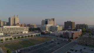 DX0001_001219 - 5.7K aerial stock footage fly away from government offices and federal courthouse at sunrise, Downtown Kansas City, Missouri