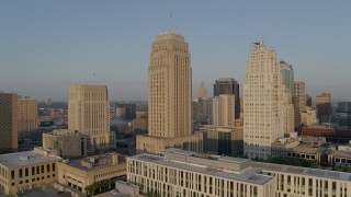 DX0001_001220 - 5.7K aerial stock footage orbit city hall and a skyscraper at sunrise, Downtown Kansas City, Missouri