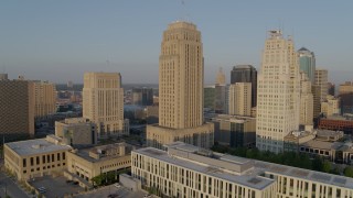 DX0001_001225 - 5.7K aerial stock footage static view and flyby courthouse, city hall and neighboring skyscraper at sunrise, Downtown Kansas City, Missouri