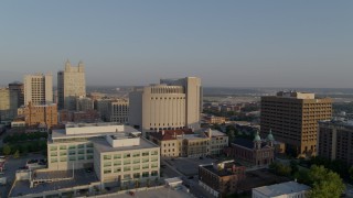 DX0001_001226 - 5.7K aerial stock footage flyby government offices, federal courthouse at sunrise, Downtown Kansas City, Missouri