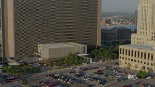 DX0001_001231 - 5.7K aerial stock footage reverse view of lower levels of a government office building at sunrise, Downtown Kansas City, Missouri