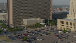 DX0001_001235 - 5.7K aerial stock footage fly away from a government office building at sunrise, Downtown Kansas City, Missouri