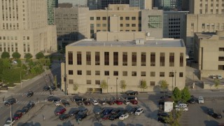 DX0001_001238 - 5.7K aerial stock footage of a view of the downtown police station at sunrise, Downtown Kansas City, Missouri