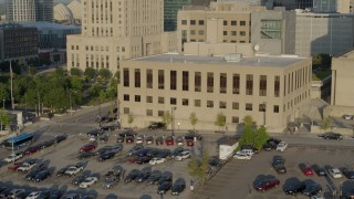 DX0001_001239 - 5.7K aerial stock footage slow flyby of the downtown police station at sunrise, Downtown Kansas City, Missouri