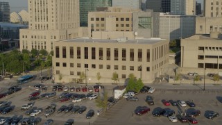 DX0001_001242 - 5.7K aerial stock footage a static and reverse view of the downtown police station at sunrise, Downtown Kansas City, Missouri