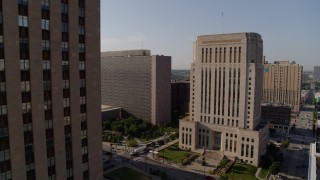 DX0001_001264 - 5.7K aerial stock footage static view of government office building beside courthouse at sunrise, Downtown Kansas City, Missouri