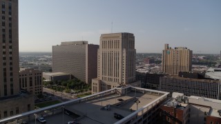 DX0001_001265 - 5.7K aerial stock footage of flying toward the downtown courthouse at sunrise, Downtown Kansas City, Missouri