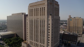 DX0001_001266 - 5.7K aerial stock footage of flying away from the downtown courthouse at sunrise, Downtown Kansas City, Missouri