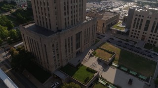 DX0001_001268 - 5.7K aerial stock footage tilt from static view of city hall front steps at sunrise and orbit building, Downtown Kansas City, Missouri