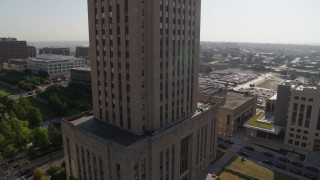 DX0001_001271 - 5.7K aerial stock footage of orbiting city hall at sunrise, Downtown Kansas City, Missouri