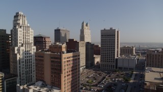 DX0001_001274 - 5.7K aerial stock footage of a group of city skyscrapers at sunrise, Downtown Kansas City, Missouri