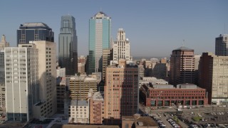 DX0001_001278 - 5.7K aerial stock footage of orbiting a tall downtown skyscraper at sunrise, Downtown Kansas City, Missouri