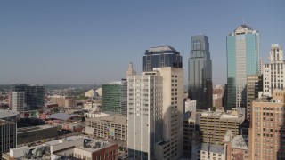 DX0001_001280 - 5.7K aerial stock footage of approaching a downtown office building at sunrise, Downtown Kansas City, Missouri