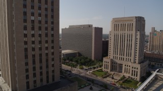 DX0001_001284 - 5.7K aerial stock footage flyby city hall to reveal the police station at sunrise, Downtown Kansas City, Missouri