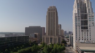 DX0001_001287 - 5.7K aerial stock footage stationary view, flyby city hall near a tall skyscraper in Downtown Kansas City, Missouri