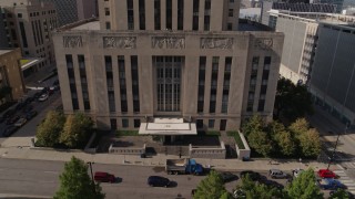 DX0001_001291 - 5.7K stock footage aerial video flying away from entrance of city hall in Downtown Kansas City, Missouri