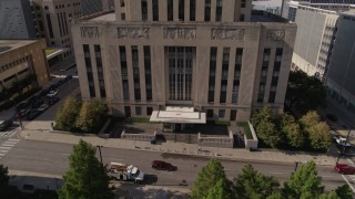 DX0001_001296 - 5.7K aerial stock footage of flying away from the city hall entrance in Downtown Kansas City, Missouri