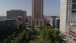 DX0001_001301 - 5.7K aerial stock footage fly over park to approach city hall in Downtown Kansas City, Missouri