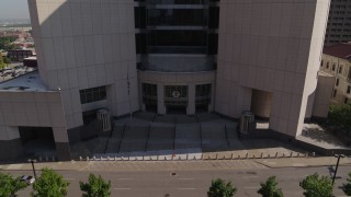 DX0001_001304 - 5.7K aerial stock footage of a reverse view of federal courthouse entrance in Downtown Kansas City, Missouri