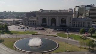 DX0001_001308 - 5.7K aerial stock footage orbit historic train station and fountain in Kansas City, Missouri