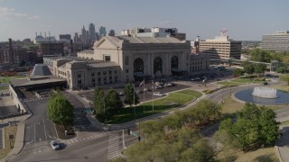 DX0001_001309 - 5.7K stock footage aerial video orbiting an historic train station and fountain in Kansas City, Missouri