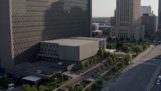 DX0001_001325 - 5.7K aerial stock footage of a reverse view of a government office building in Downtown Kansas City, Missouri