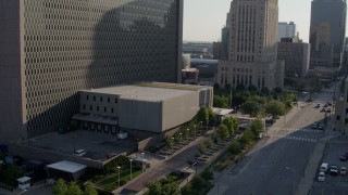 DX0001_001327 - 5.7K aerial stock footage stationary and reverse view of entrance to a government office building in Downtown Kansas City, Missouri