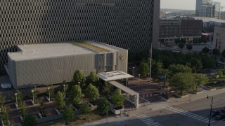 DX0001_001336 - 5.7K aerial stock footage fly away from entrance of government office building in Downtown Kansas City, Missouri