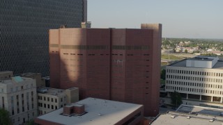 DX0001_001337 - 5.7K aerial stock footage fly away from a city prison in Downtown Kansas City, Missouri