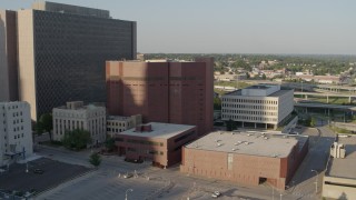 DX0001_001340 - 5.7K aerial stock footage of a stationary view of a city prison in Downtown Kansas City, Missouri