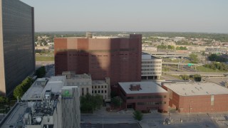 DX0001_001342 - 5.7K aerial stock footage of orbiting around a city prison in Downtown Kansas City, Missouri