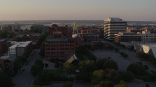 DX0001_001352 - 5.7K aerial stock footage approach brick office building and cathedral steeple at sunset in Downtown Kansas City, Missouri