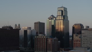 DX0001_001355 - 5.7K aerial stock footage static view of light reflecting off of skyscrapers at sunset in Downtown Kansas City, Missouri
