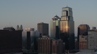 DX0001_001356 - 5.7K aerial stock footage static view and flyby of skyscrapers at sunset in Downtown Kansas City, Missouri