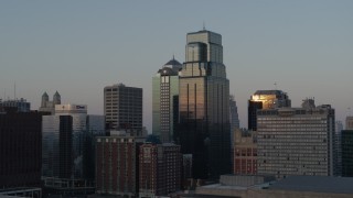 DX0001_001357 - 5.7K aerial stock footage flyby skyscrapers reflecting the sunset in Downtown Kansas City, Missouri