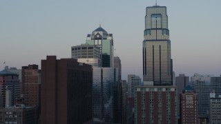 DX0001_001362 - 5.7K stock footage aerial video flyby tall city skyscrapers at sunset in Downtown Kansas City, Missouri