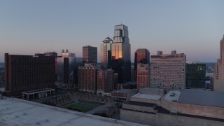 DX0001_001369 - 5.7K aerial stock footage flyby skyscrapers near hotel at sunset and hover for static view in Downtown Kansas City, Missouri