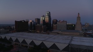 DX0001_001389 - 5.7K aerial stock footage pass and approach downtown hotel and skyscrapers at twilight in Downtown Kansas City, Missouri