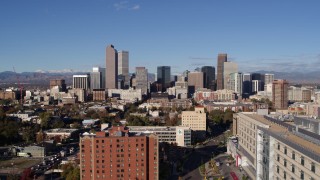 DX0001_001437 - 5.7K aerial stock footage ascend to stationary view of skyscrapers in Downtown Denver, Colorado