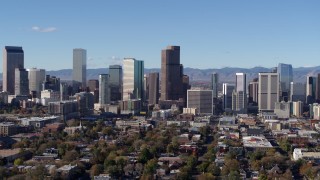 DX0001_001456 - 5.7K aerial stock footage flying by skyscrapers in Downtown Denver, Colorado skyline