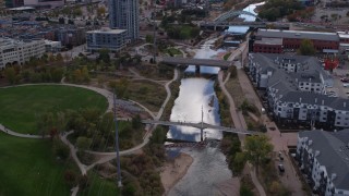 DX0001_001499 - 5.7K aerial stock footage of the South Platte River and bridges in Downtown Denver, Colorado