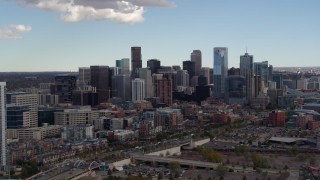 DX0001_001513 - 5.7K aerial stock footage of the city's skyline seen from near a residential skyscraper in Downtown Denver, Colorado