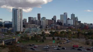 DX0001_001518 - 5.7K aerial stock footage of a stationary view of a residential skyscraper and city skyline in Downtown Denver, Colorado