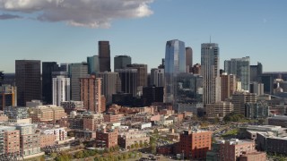 DX0001_001522 - 5.7K aerial stock footage of slowly flying by the city skyline in Downtown Denver, Colorado